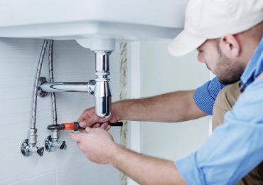 plumber fixing sink plumbing in California home plumber fixing sink plumbing in California home