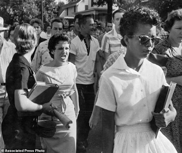 Elizabeth Eckford of Little Rock Nine harassed by Hazel Massery while attempting to enter heathen high-school on September 4, 1957.