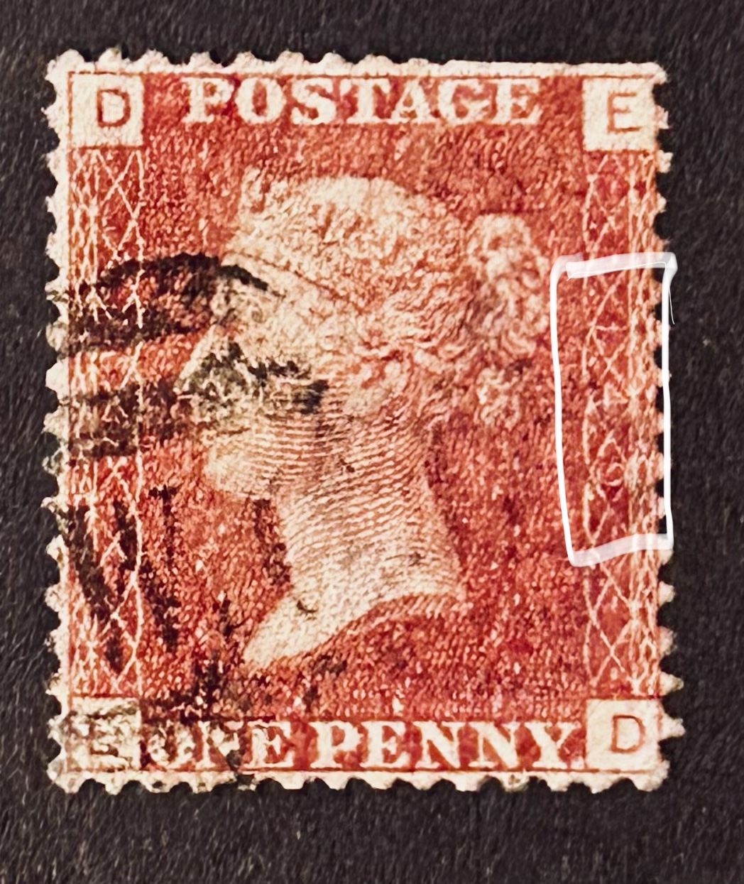 Close-up of Penny Red Plate Number, here plate number is 149 and letters DE, this stamps is from 1871.