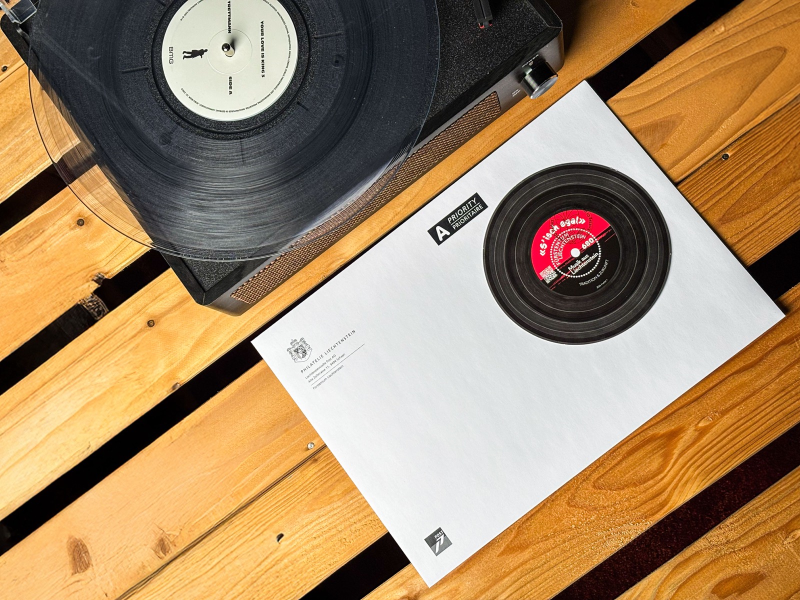 Liechtenstein playable vinyl-record stamp — Music from the attic on a record player