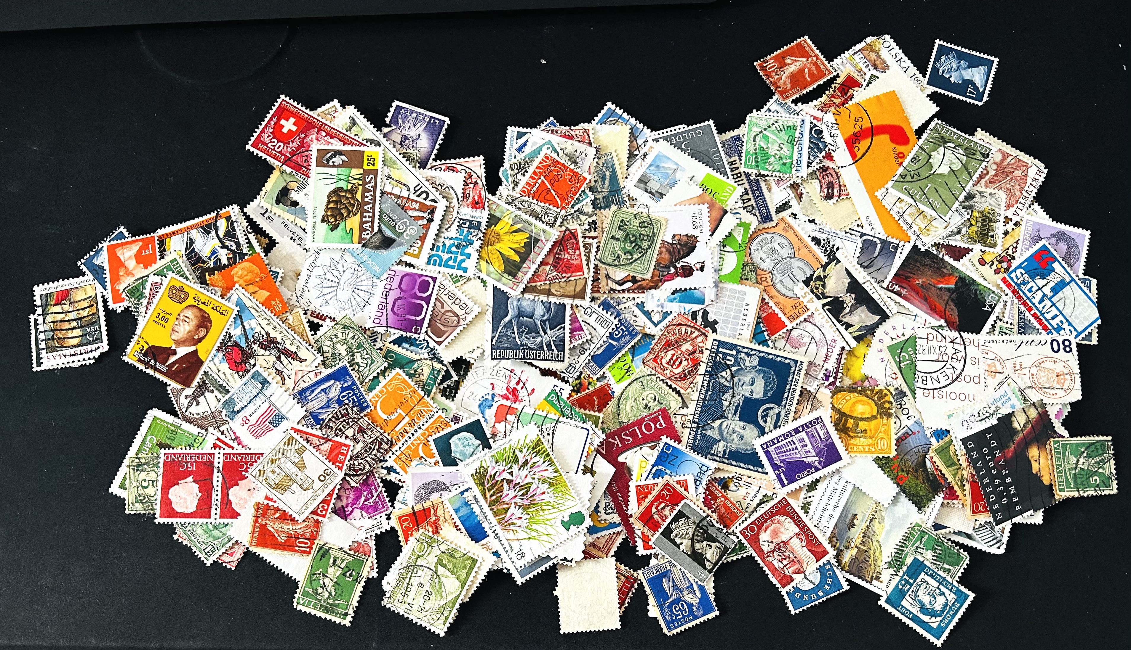 Used Stamps from around world around 30gms.(500+ stamps