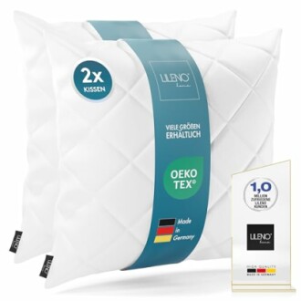 Zwei weiße Kissen mit OEKO-TEX Zertifikat und Made in Germany Label.
